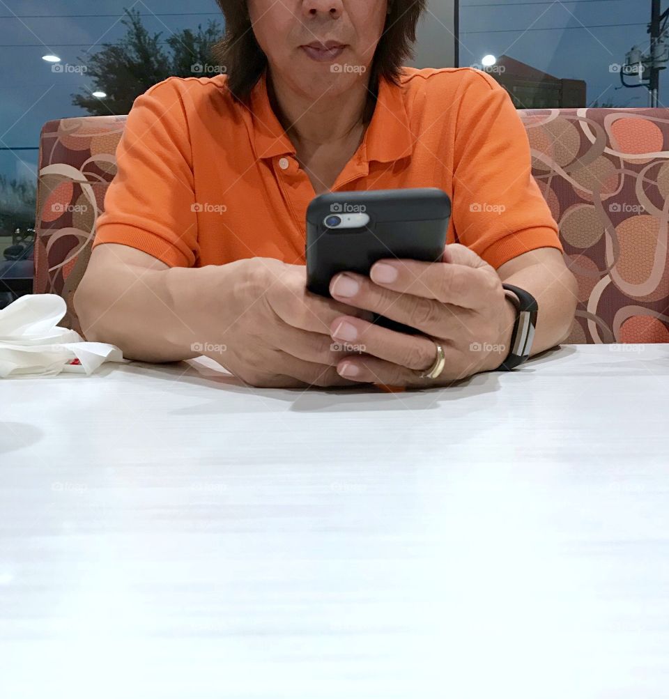 Asian man using cell phone!