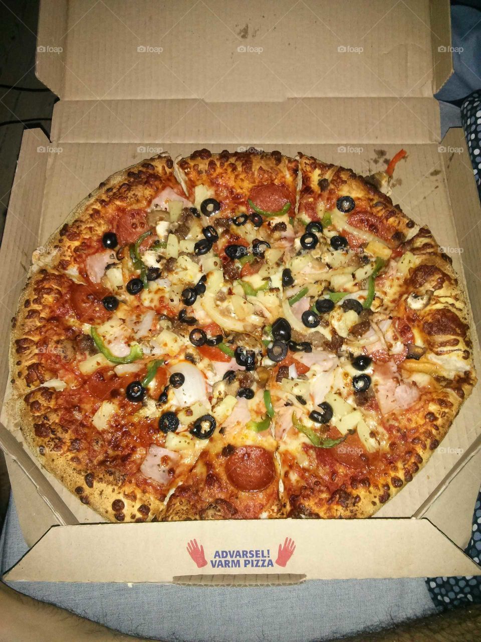 Pizza with lots of toppings.