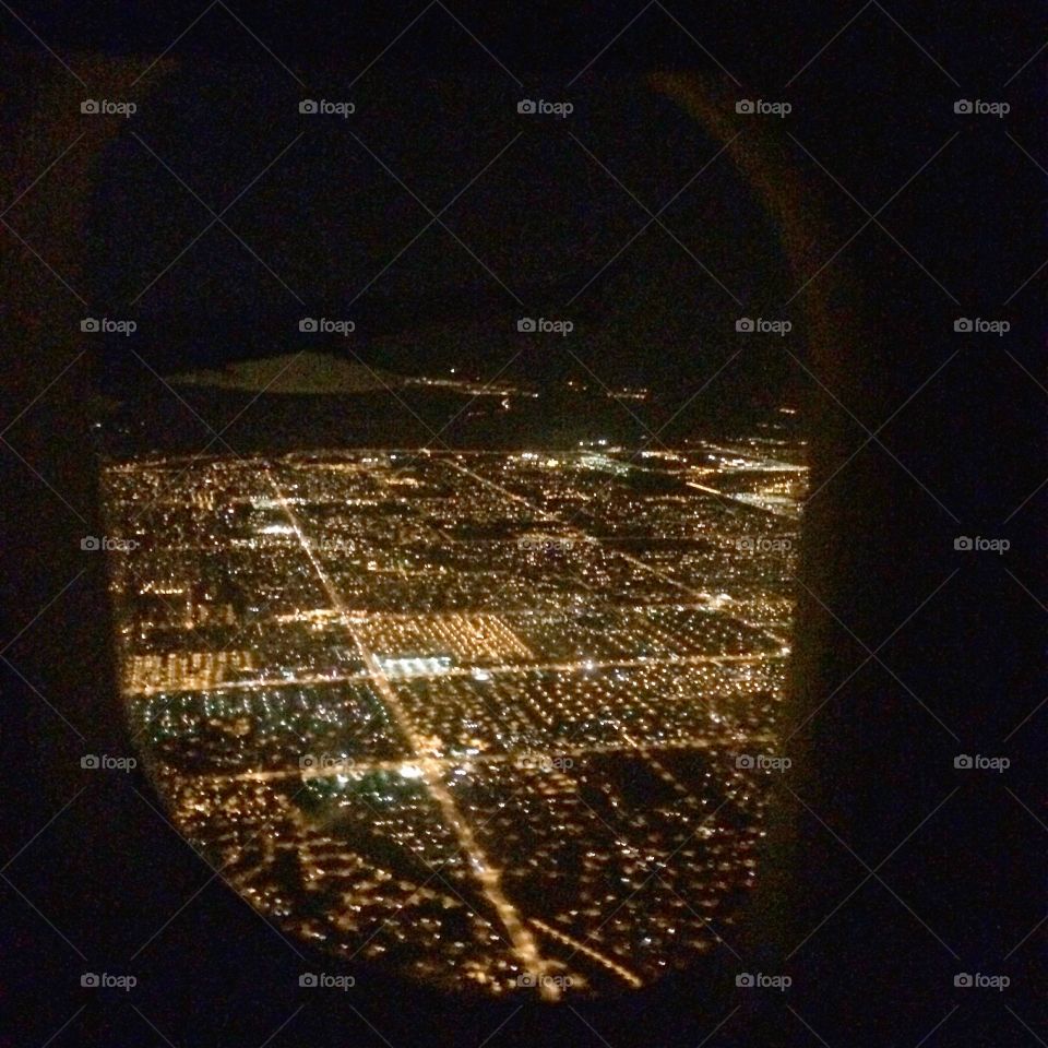 Phoenix lights from the air. A picture of the Phoenix metro area city lights at night as seen from an airplane window before landing. 