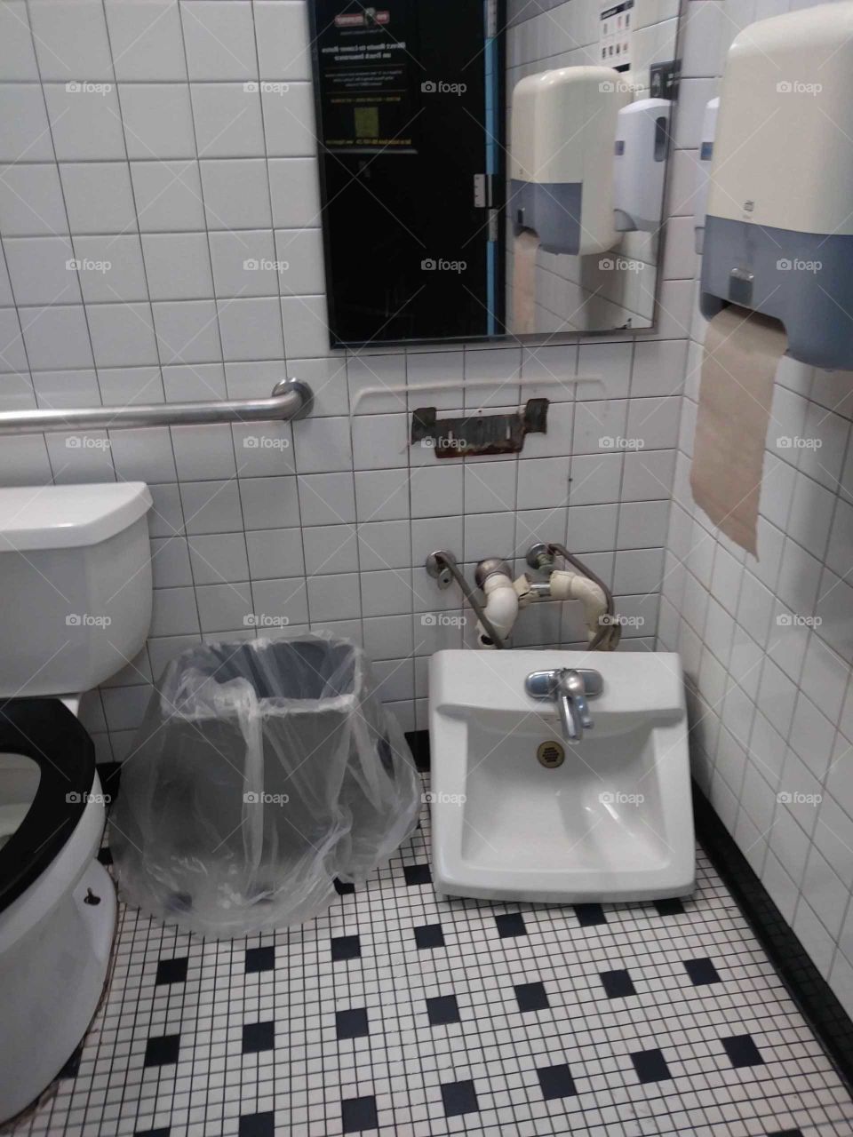 sink on floor in bathroom