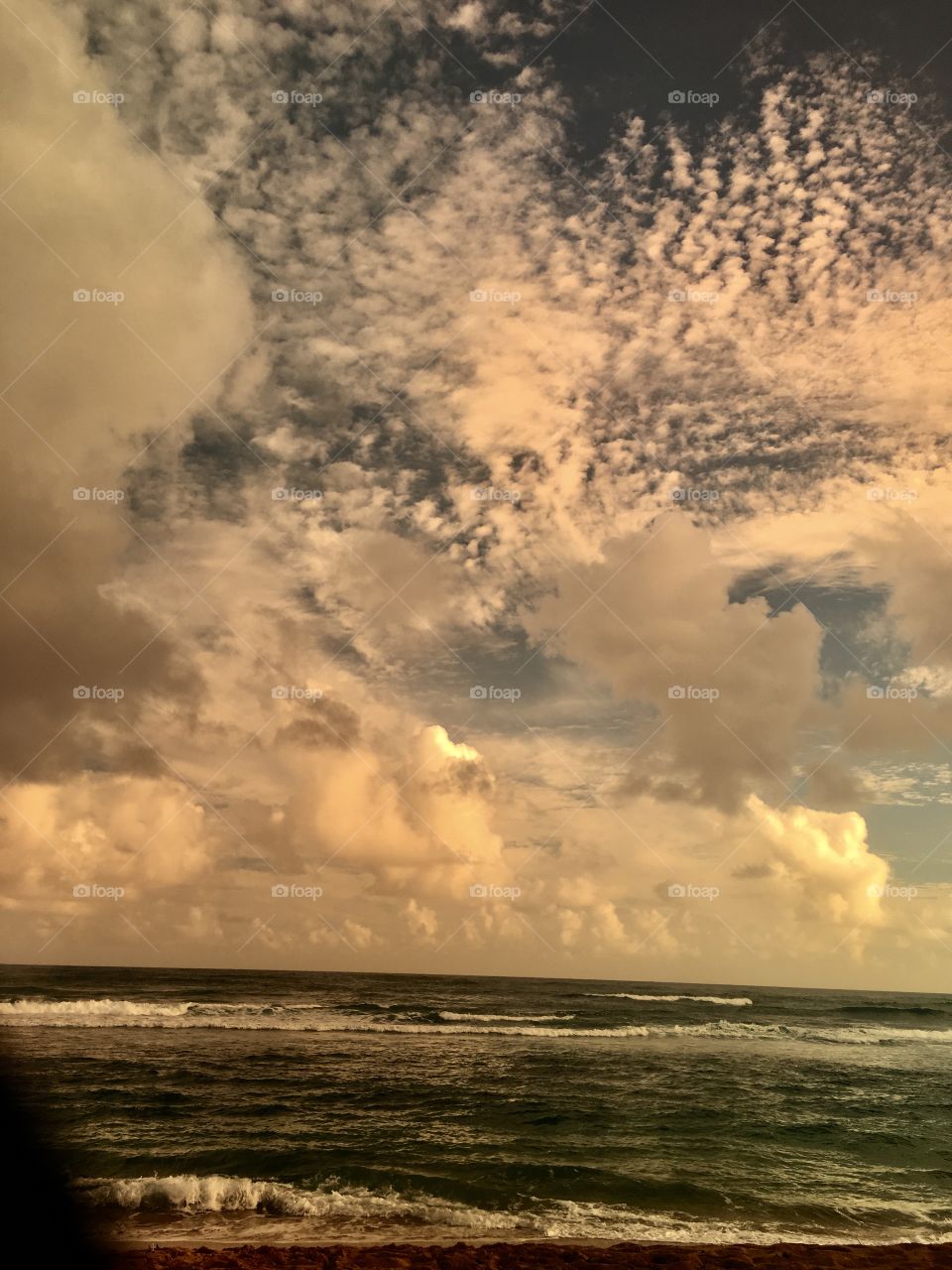 Sand and sea and clouds