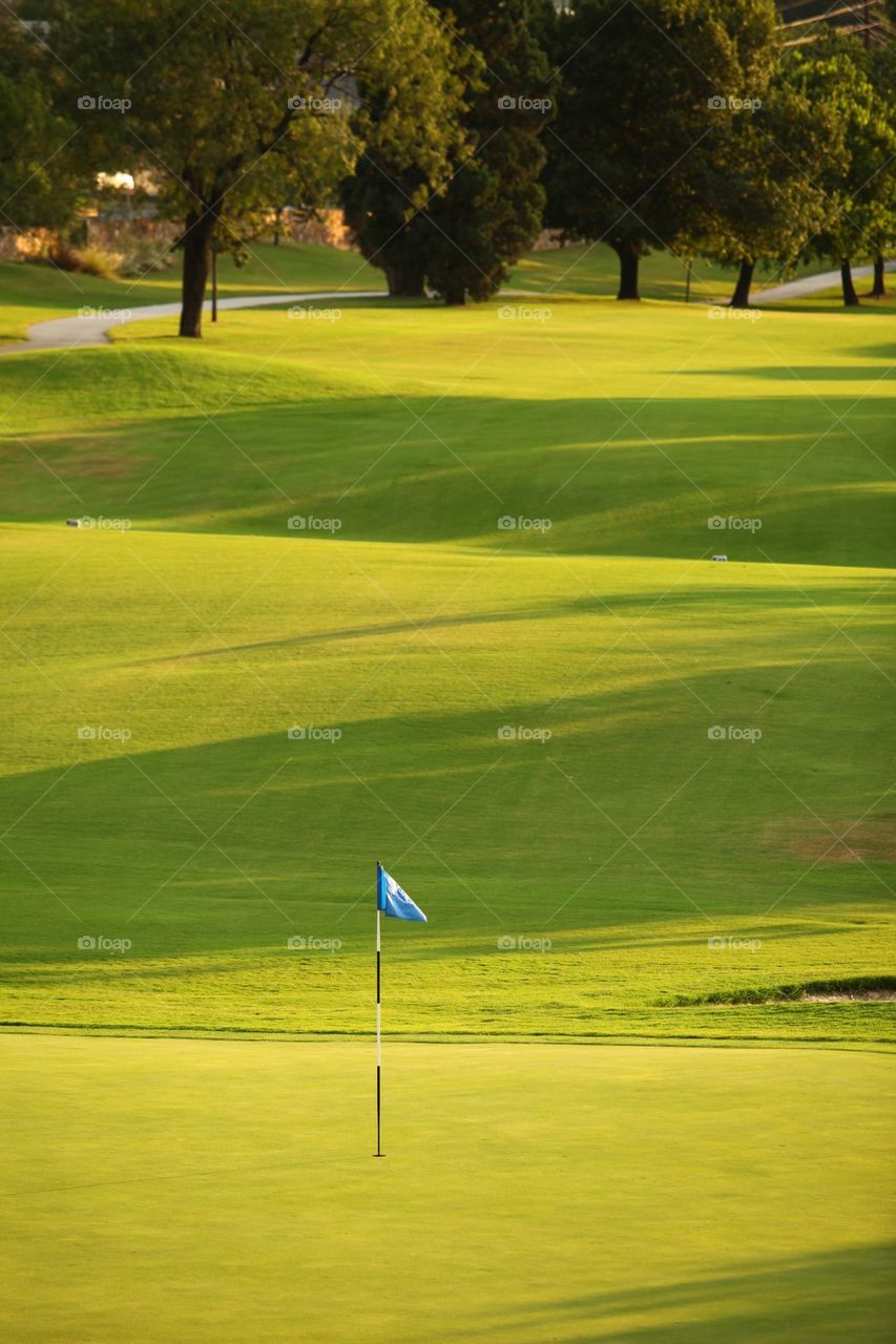 Club Campestre Golf course green area on a summer sunset