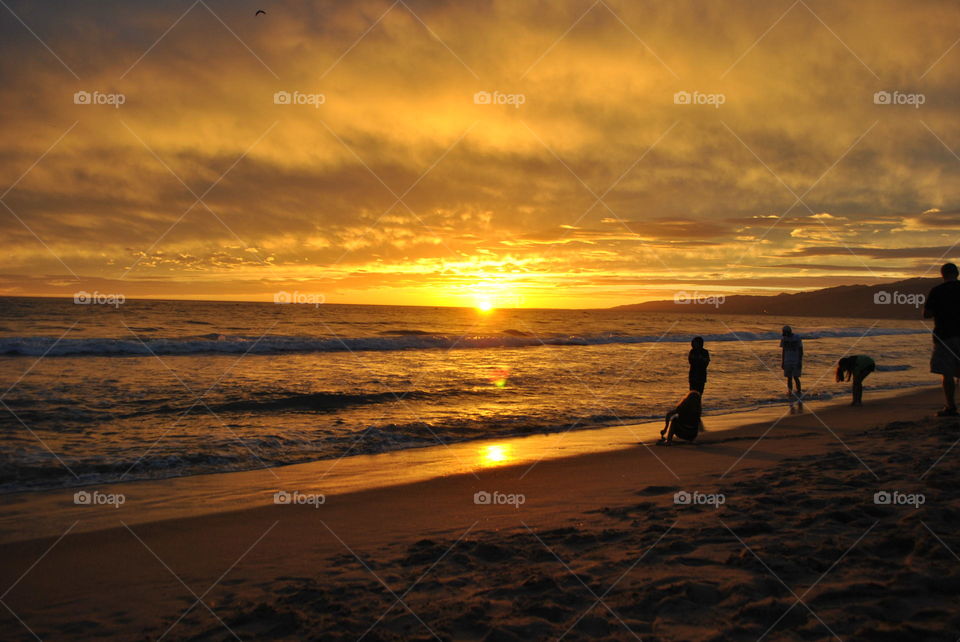 People watching the sunset at Santa Monica beach