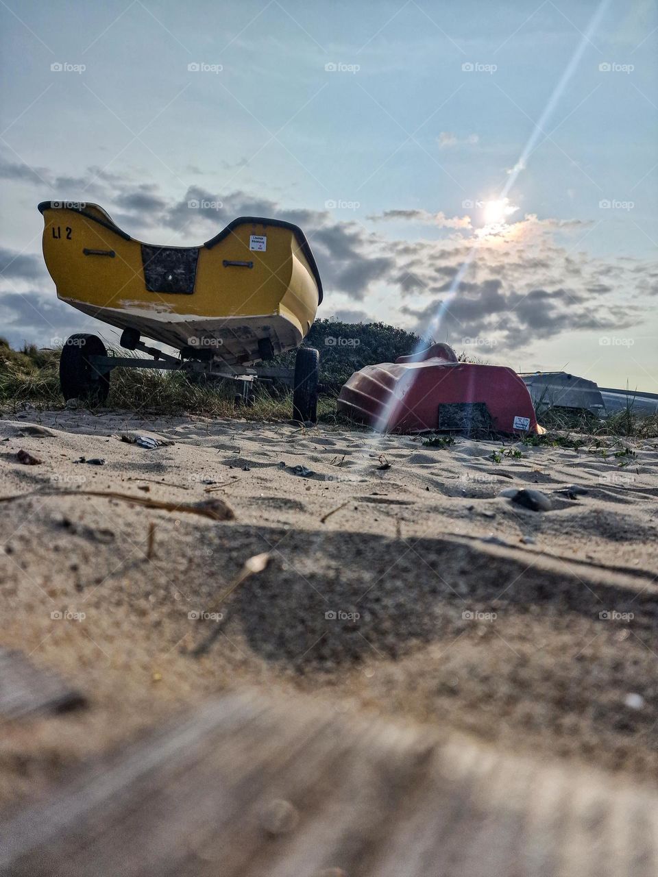 Yellow boat on the beach