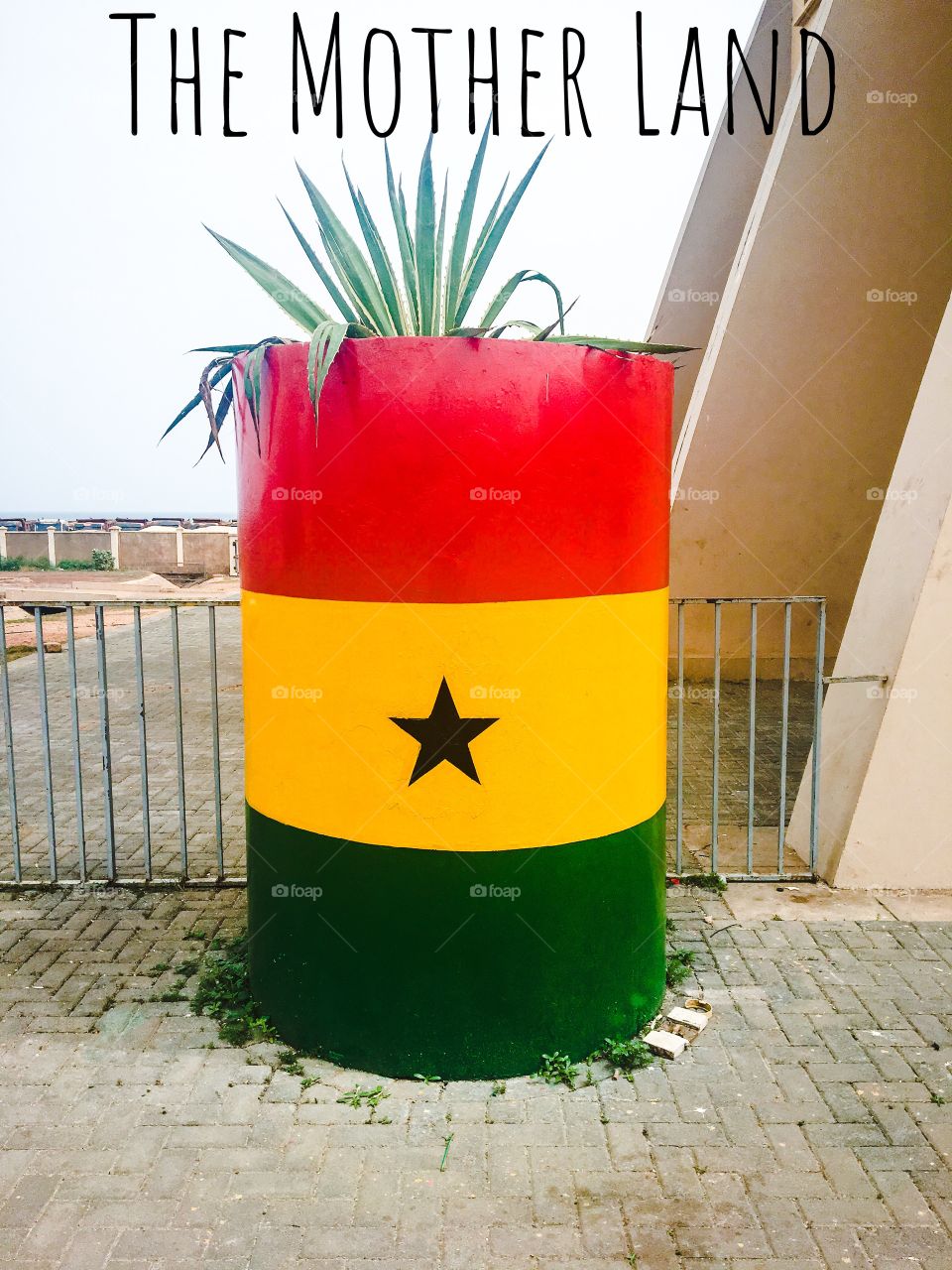 Ghana flag on metal dram taken on holiday in Ghana