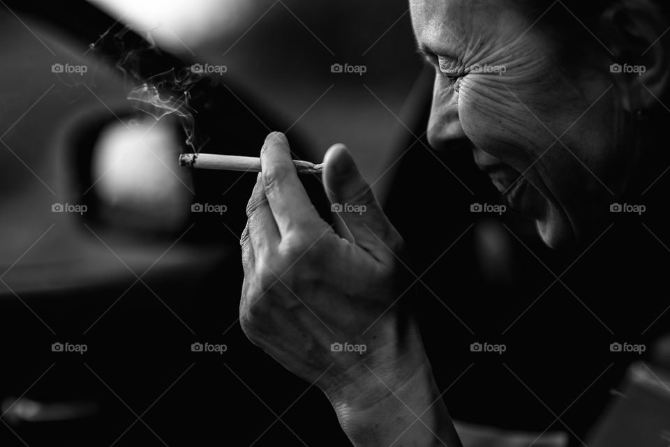Candid portrait of woman smoking cigarette