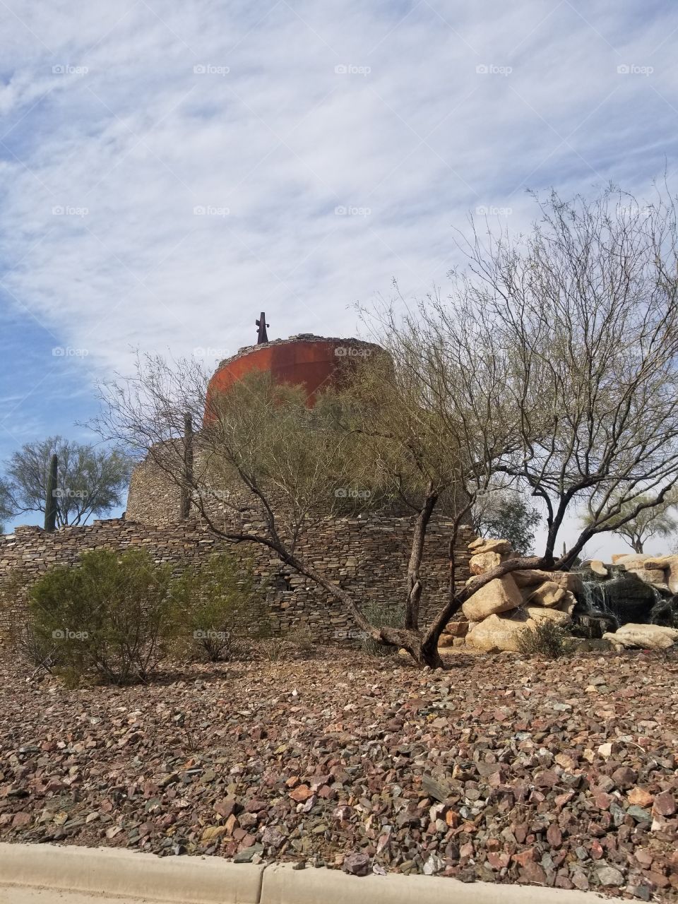 brick building circle cactus branches
