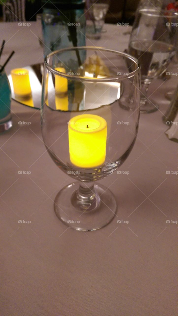 candle within the glass