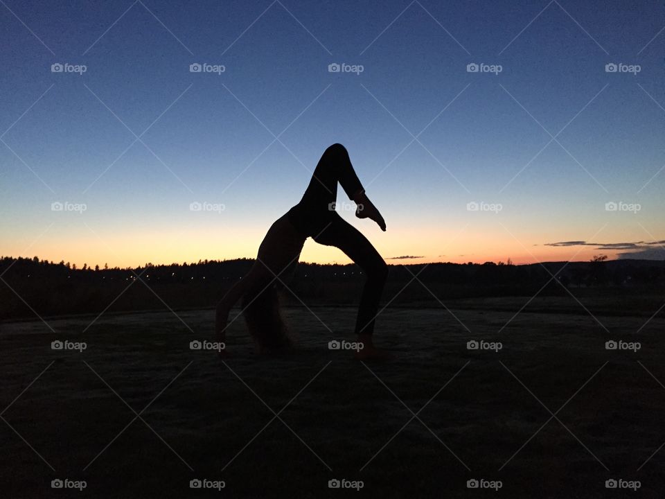 silhouette yoga in sunset