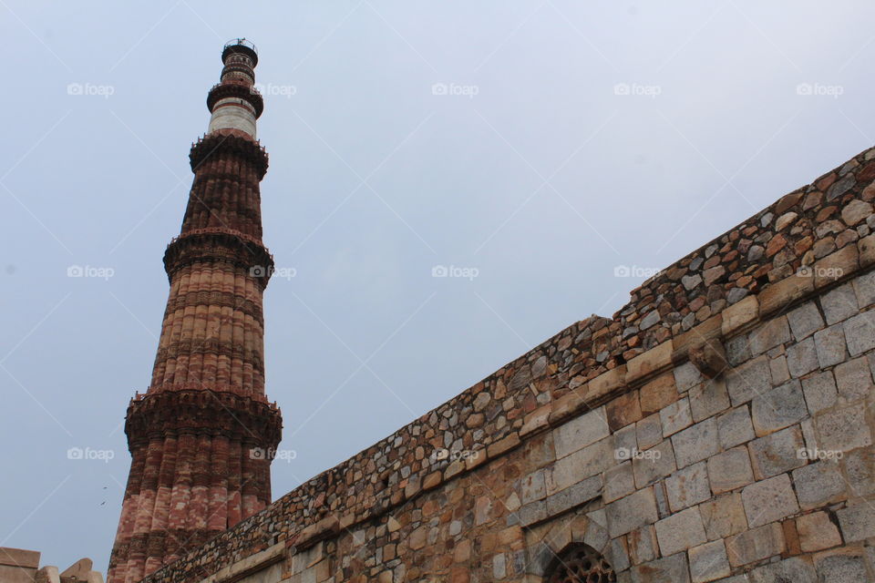 Qutub Minar in Delhi. This is the tallest brick minaret in the world and was built in 12th century AD. This is one of most sought after tourist destination in Delhi and is also a UNESCO World Heritage site.