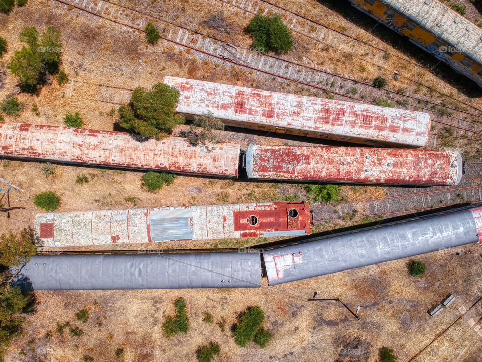 Aerial view of rusting railway carriages