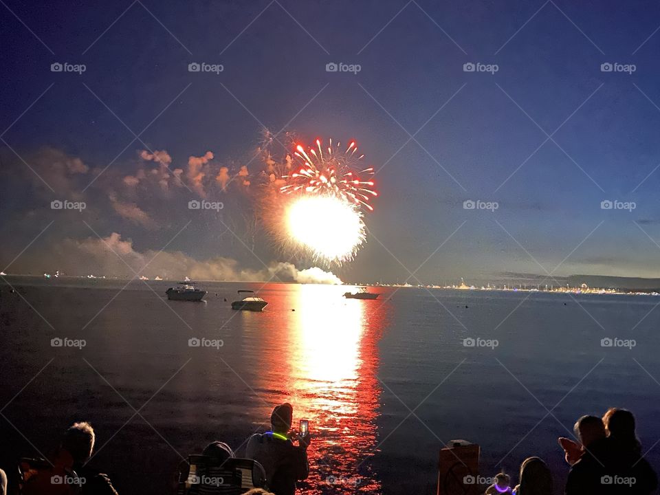 People watching and photographing fireworks, Lewis Bay, Cape Cod