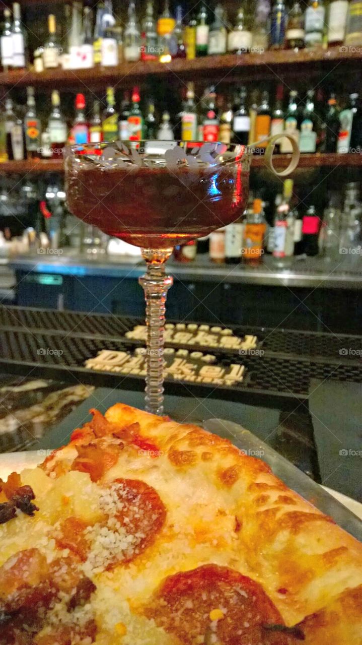 whiskey cocktail and pizza