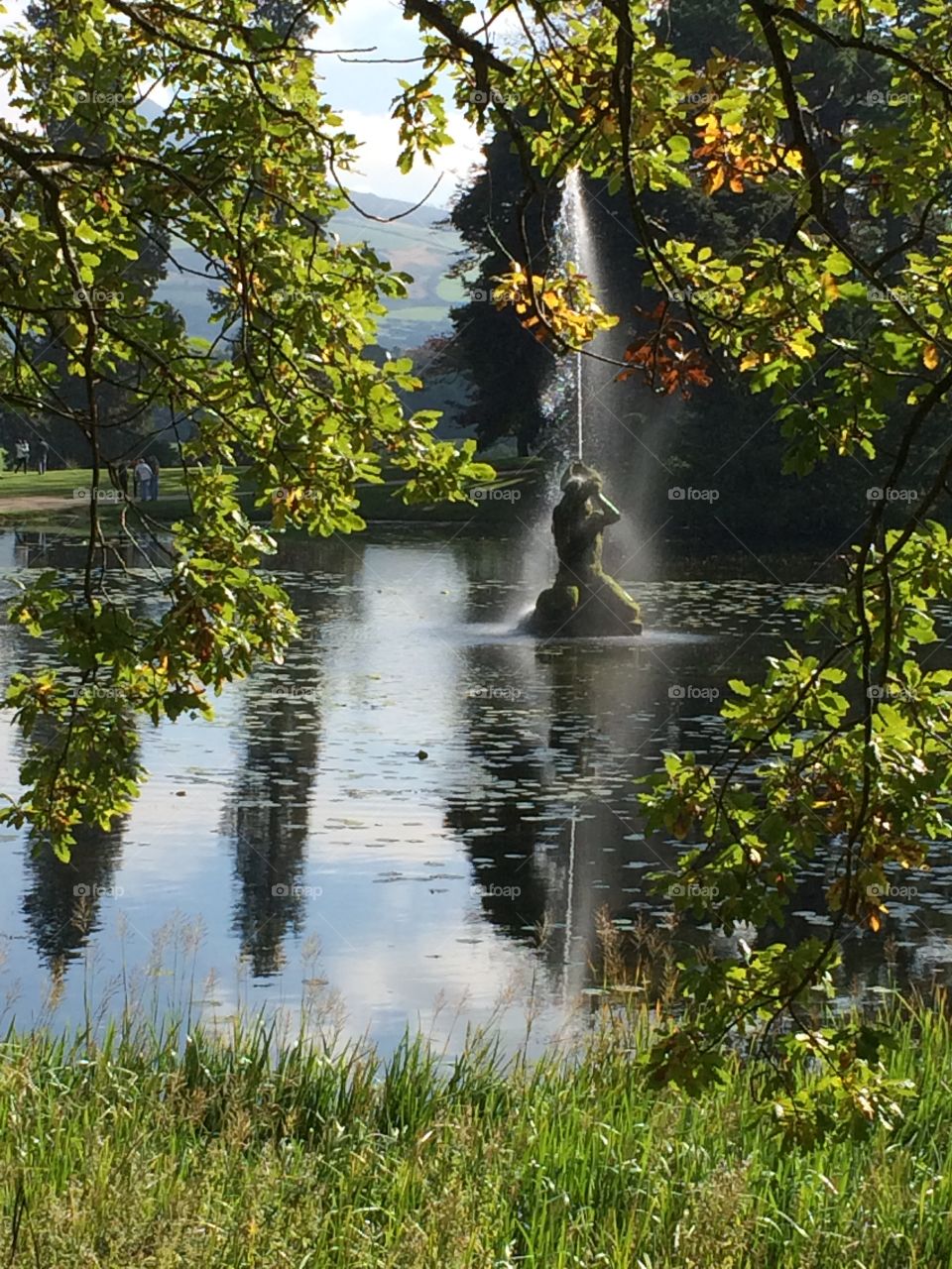 Statue in man made lake at Powerscourt in Ireland
