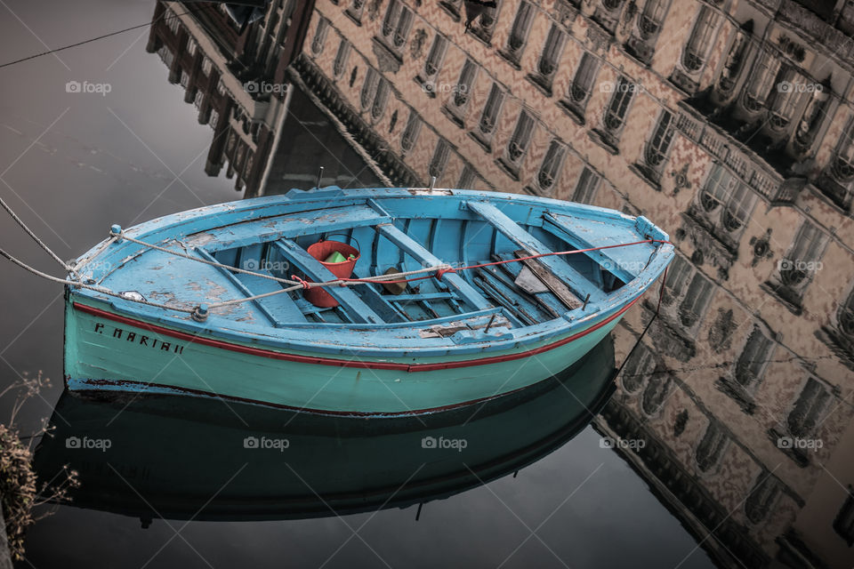 Old boat and water reflections 