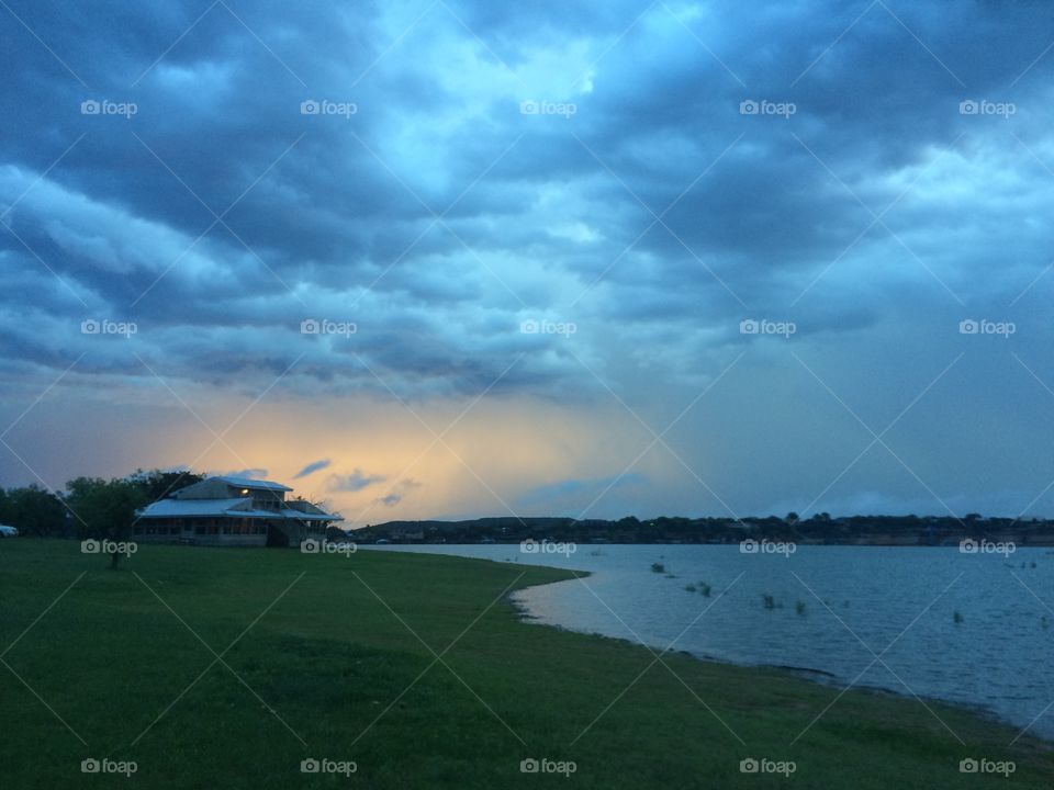 Landscape of lake shore with rain coming in 