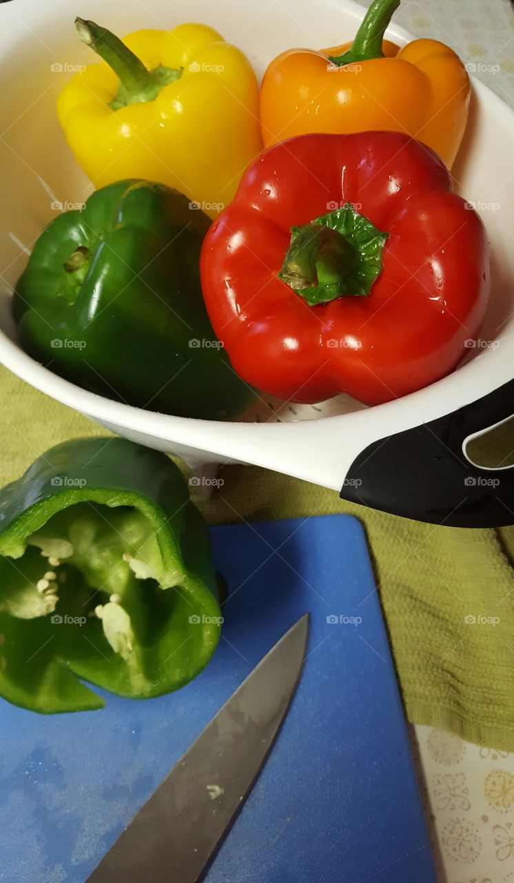 Cutting up bell peppers for dinner.