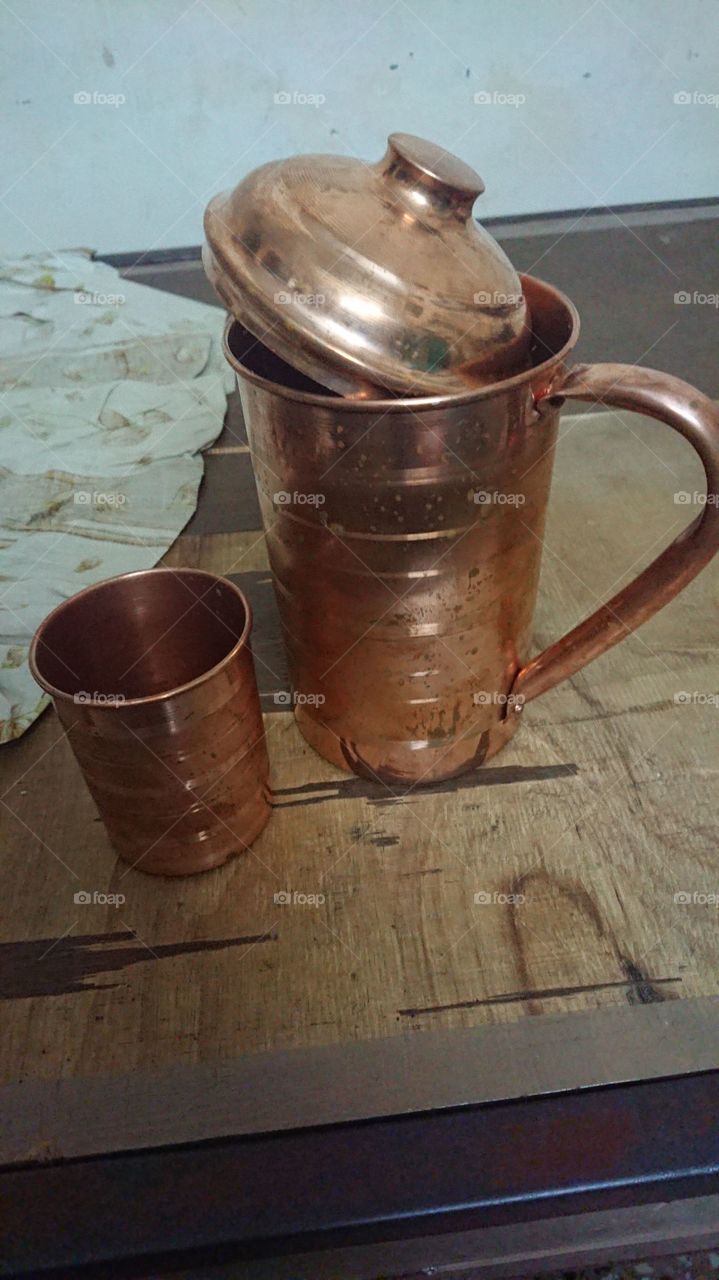 Copper jug with glass
