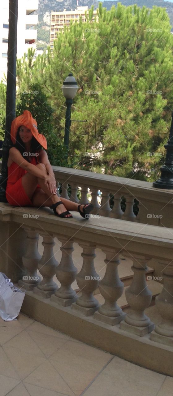 Girl in the orange clothes up to the stairs 