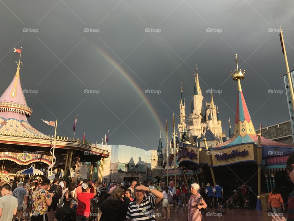 A rainbow ends at Cinderella's Castle in Disney's Magic Kingdom  in Orlando Florida