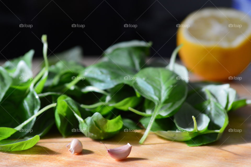 Spinach and garlic on table