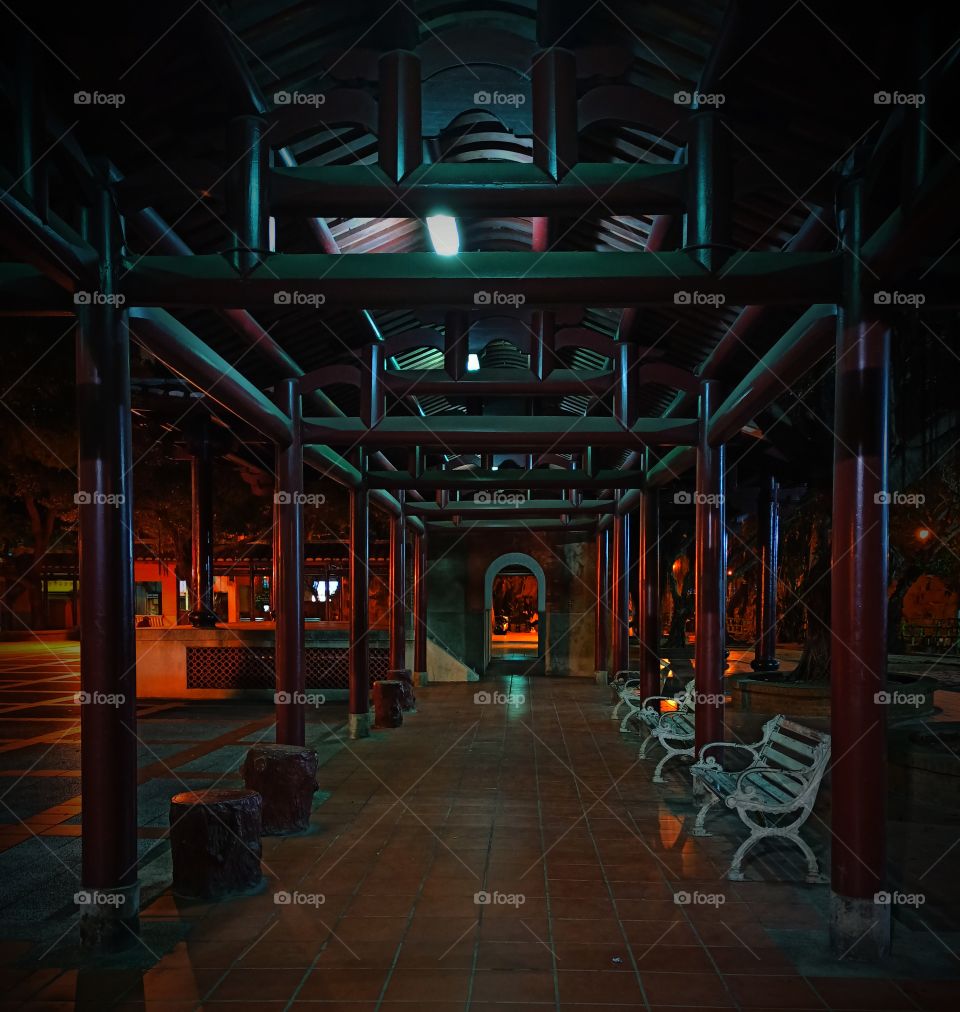 Red pillars in the temple at night.