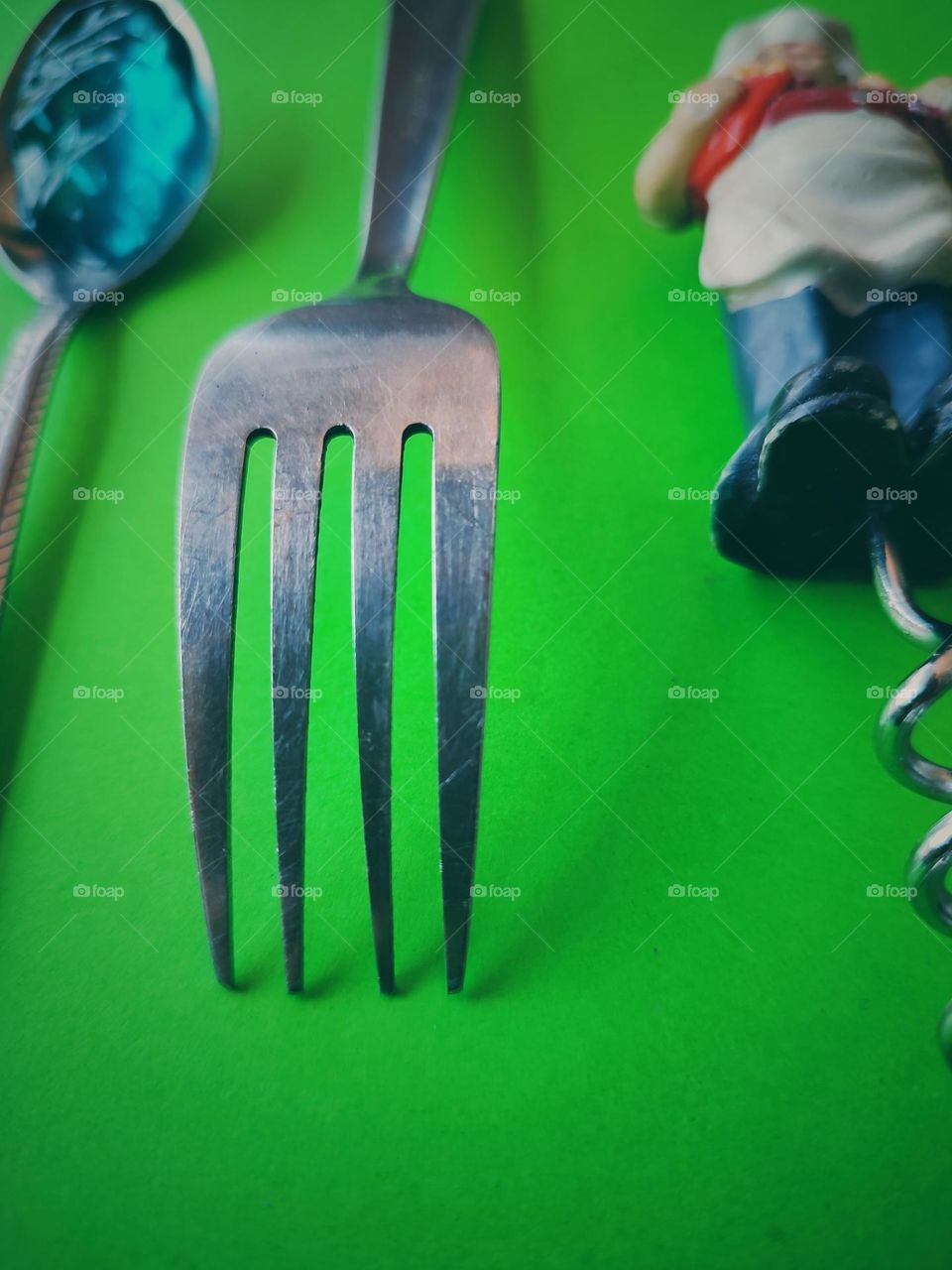 Fork on green background