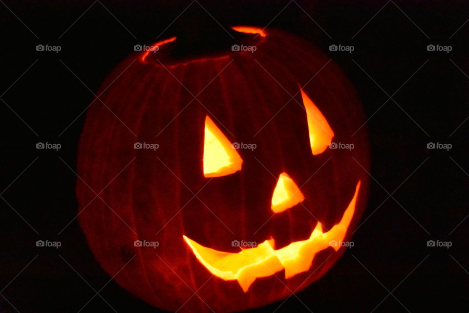 Pumpkin lit up at night