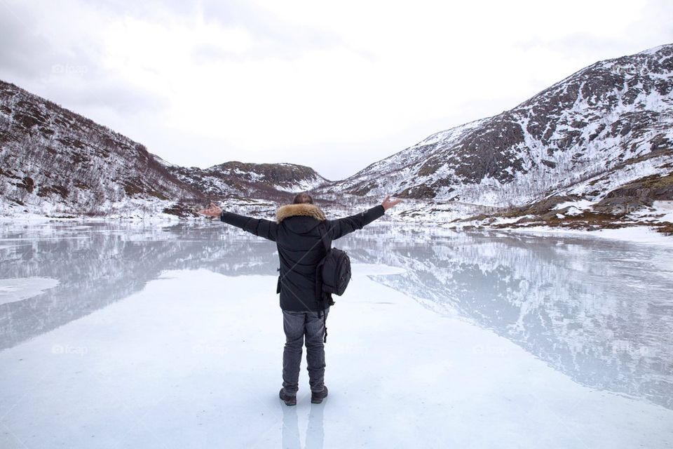 Rear view of person standing in snow