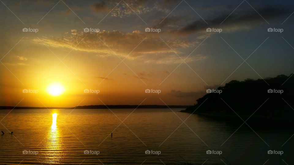 lake sunrise. a warm texas sunrise over lake belton 