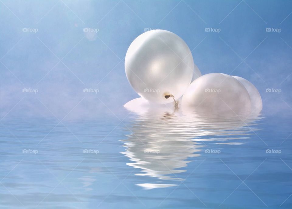 Balloons floating or sinking in water