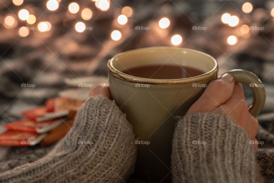woman hands and a mug of tea