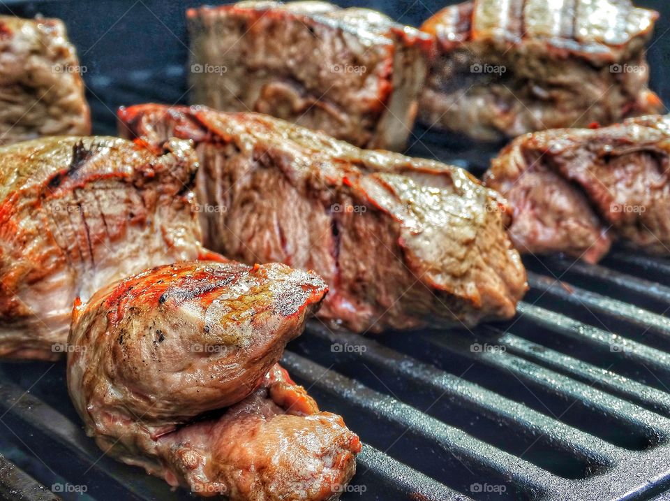 Steak Cooking On A Grill