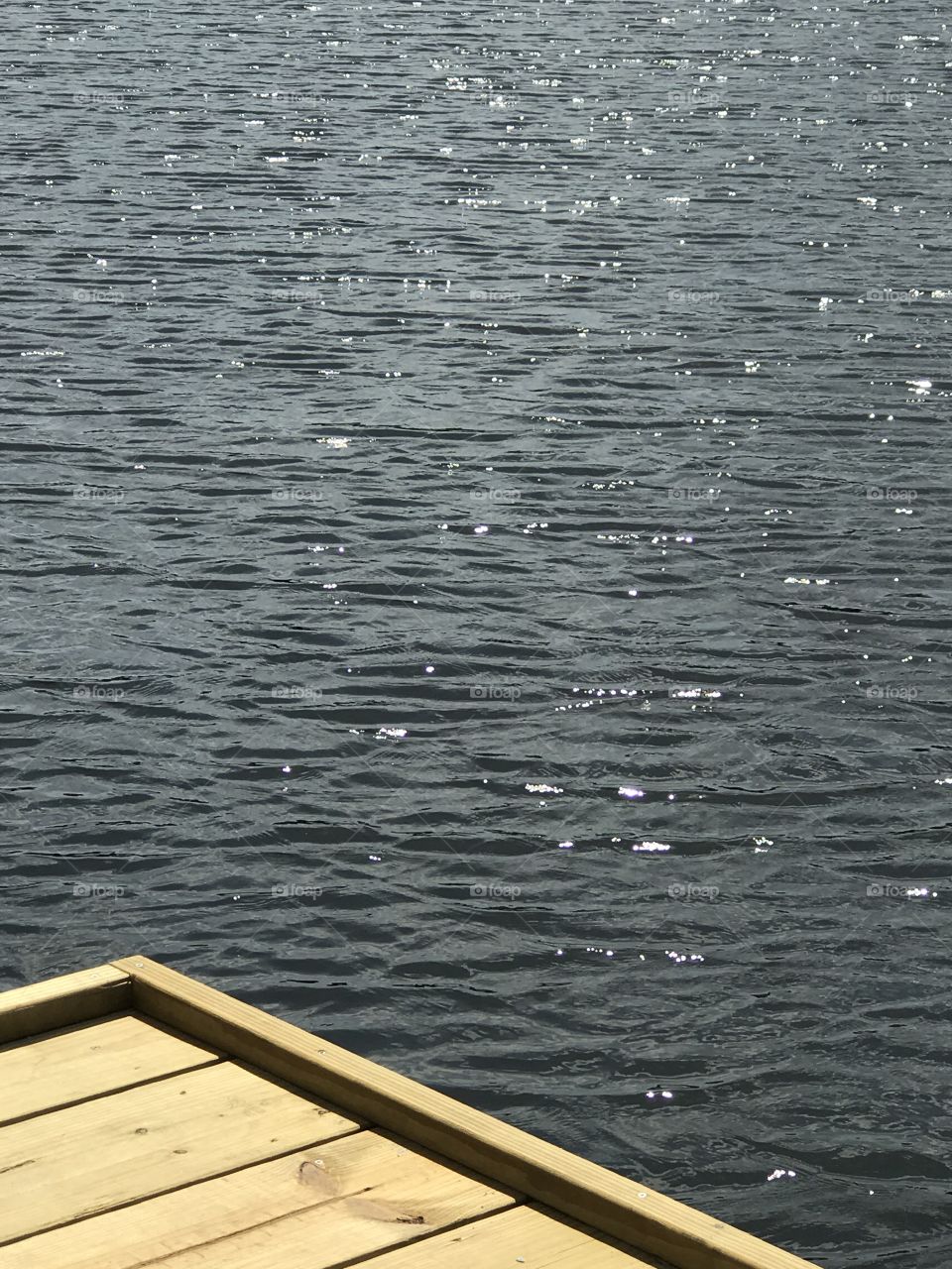 Corner of a dock over a river 