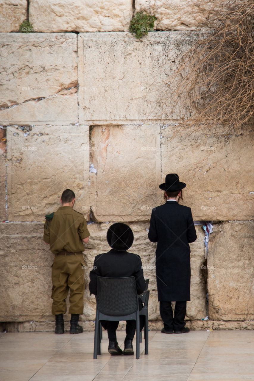 People praying at the wall