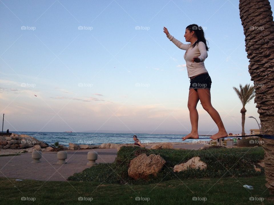 Girl slack lining