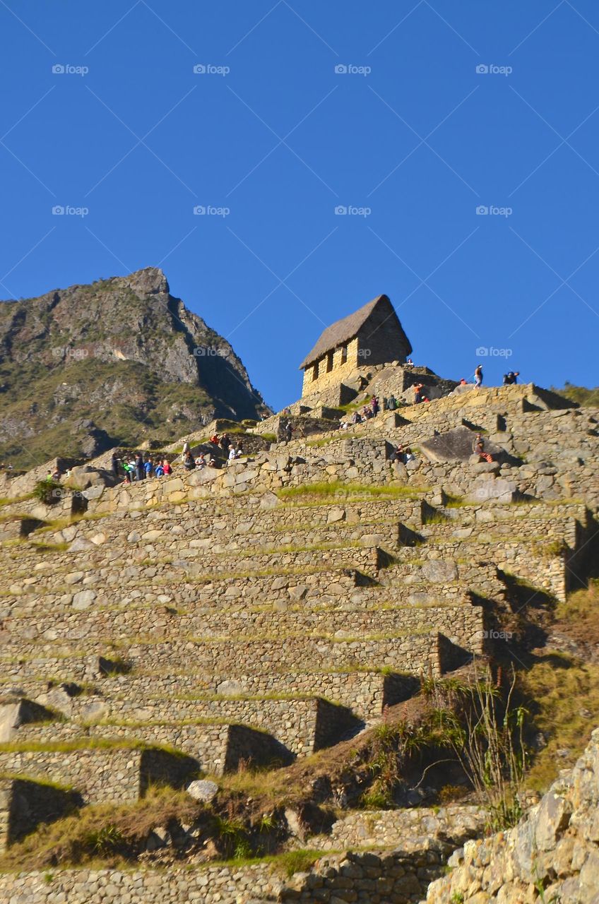 Inca House and Machu Picchu mountain views in Machu Picchu archaeological site, Peru. 