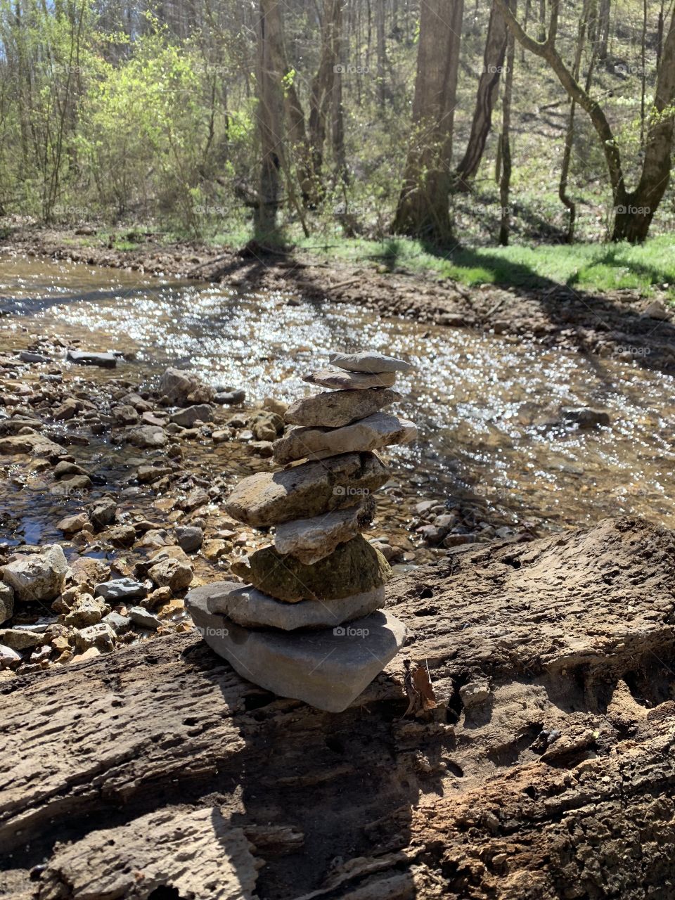 Stacking Stones by the Creek
