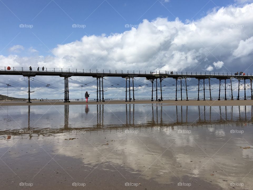 Horizontal photo capturing part of Saltburn Pier when the tide is out 