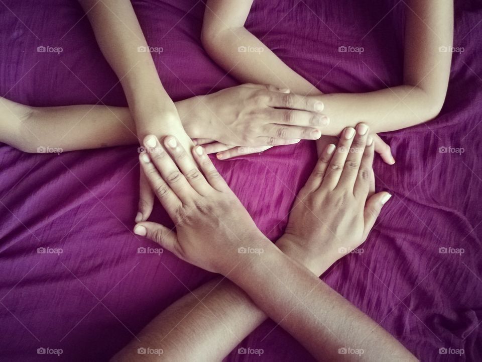 High angle view of holding hand against purple background