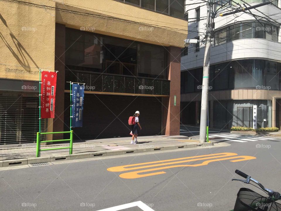 Japanese child going to school with a big backpack