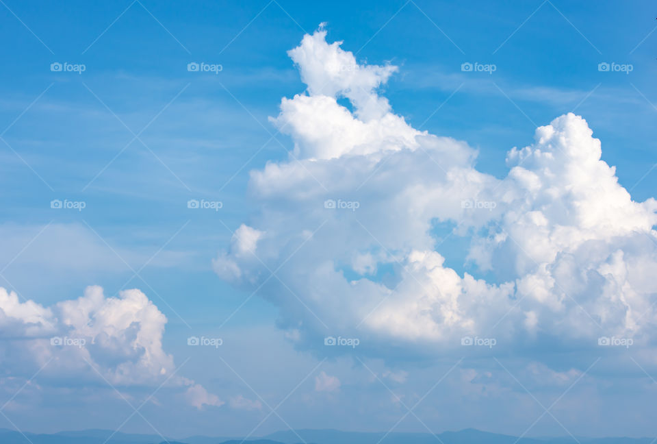 The beauty of the sky with clouds and the sun.