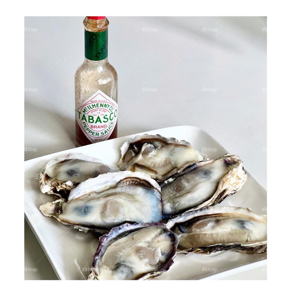 Half a dozen Freshly shucked Japanese oysters with tobacco sauce 