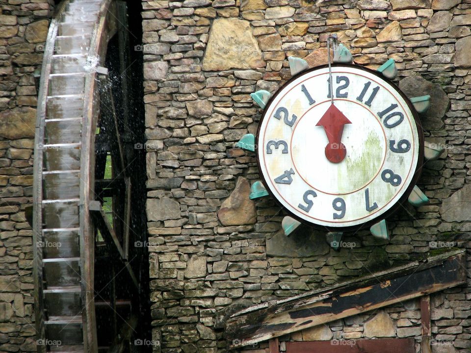 Clock by the water wheel