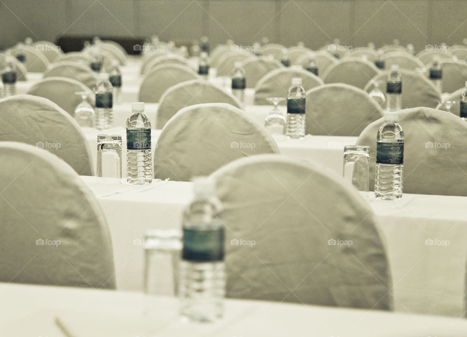 Sitting set up for conference meeting . theatre style with water bottle lined up