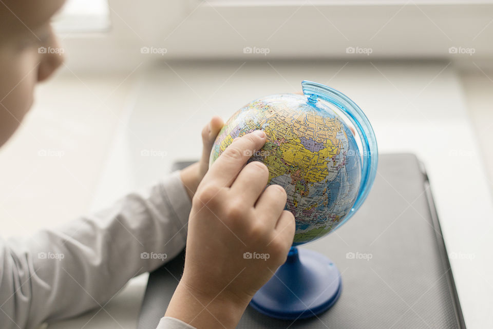 child with globe