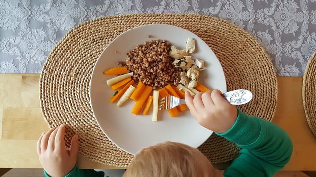 Child eating diner at home