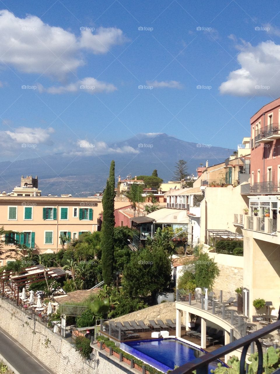Mount Etna from Taormina Sicily on a bright sunny day. Old town. Amazing view of the volcano. 