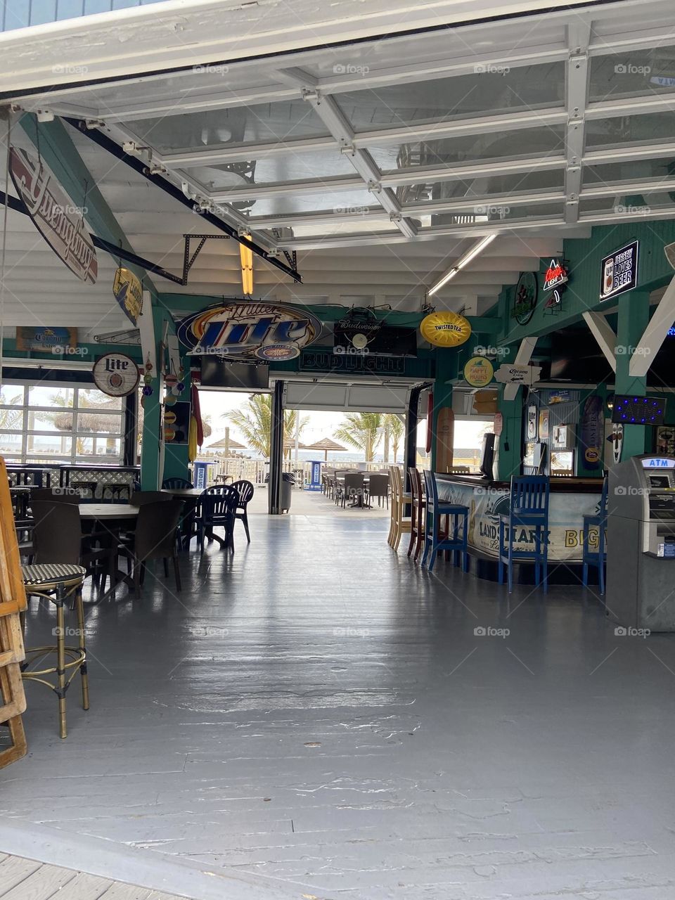 A view of the inside of Jenks Inlet Bar & Grill, a favorite local spot, located on the North end of the Point Pleasant Beach boardwalk in NJ near the Manasquan inlet. Here you can sit inside or outside and enjoy amazing views of the beach and ocean. 
