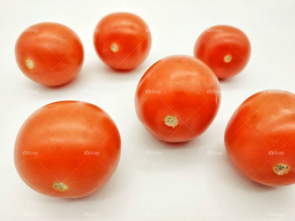 Cherry tomatoes red on white background